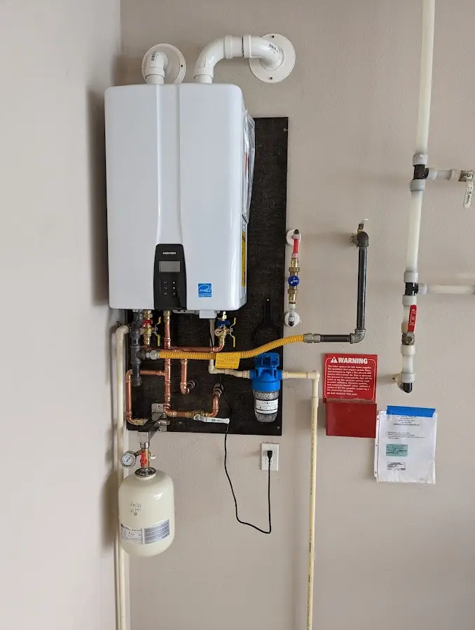 Professional plumber installing copper piping in a Dardenne Prairie home